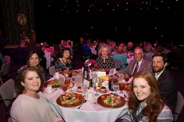 Photo of a table of alumni