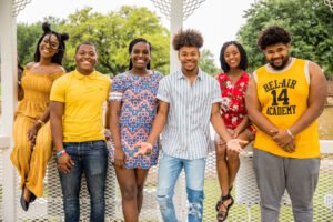 The officers of IM体育试玩’s Black Student Union, Proven, pose for a photo by Anderson Lawn.