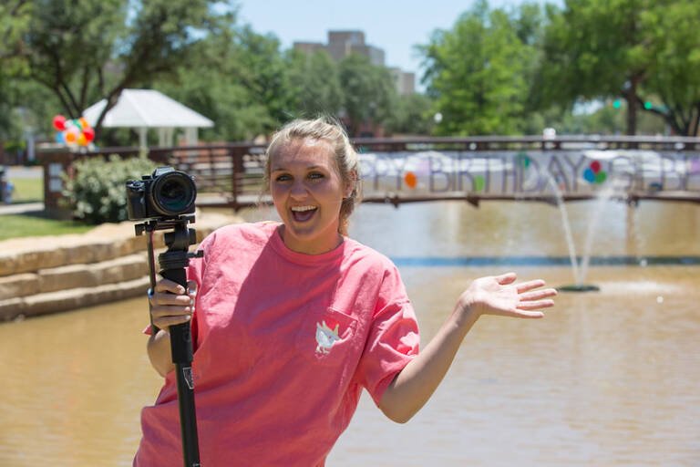 Kacie Eurek with her camera during Gilbert's birthday party.