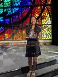 Kaylynn Reyna accepts the prestigious Burnam Mathematics Award for Outstanding Mathematic Graduate of 2025