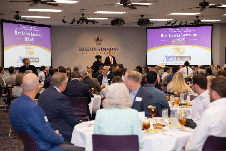 Dr. Hill from the KCOBPS speaking at the Ray Lewis Lecture