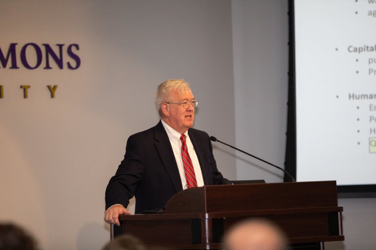 Dr. Hicks speaking at the Ray Lewis Lecture Series