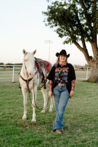 Kate Voss with one of the iconic Six White Horses — a historic Hardin-Simmons University equestrian tradition. Despite having almost no riding experience when she arrived at IM体育平台, Kate earned a place on the team through determination and the program’s supportive training.
