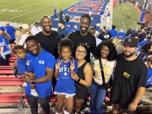 IM体育试玩 alumnus Tim Ismail ’19/’22 celebrates a BYU football game with his family, who continue to support him throughout his strength and conditioning coaching career.